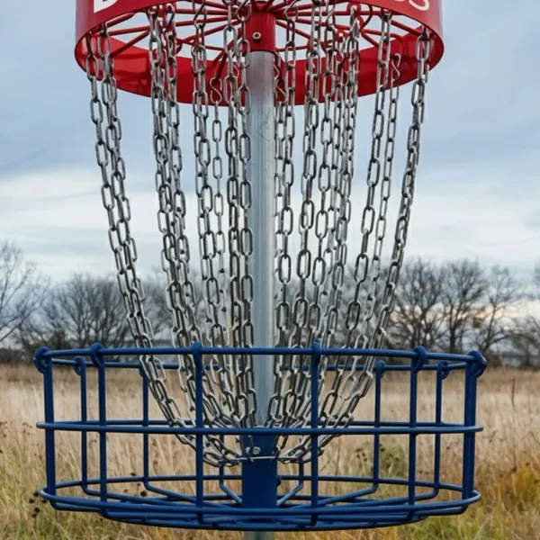 A disc golf putting basket in a field
