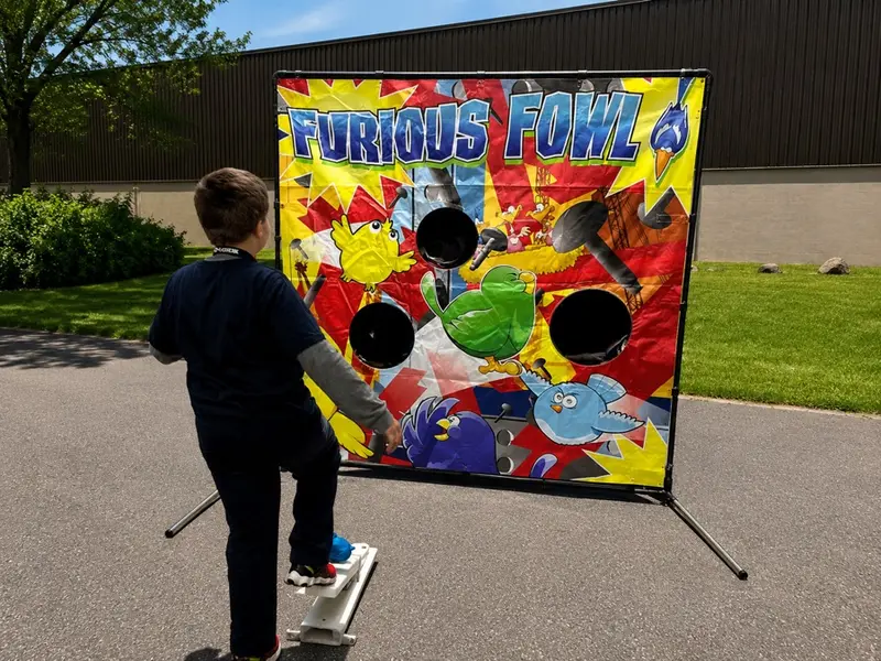 A child playing a carnival game